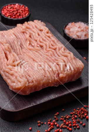 Raw minced chicken with salt, spices and herbs 125428493