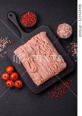 Raw minced chicken with salt, spices and herbs 125428496