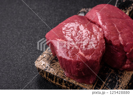Raw beef tenderloin ribeye steak with salt and spices Raw beef tenderloin ribeye steak with salt and spices 125428880
