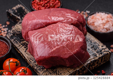 Raw beef tenderloin ribeye steak with salt and spices Raw beef tenderloin ribeye steak with salt and spices 125428884