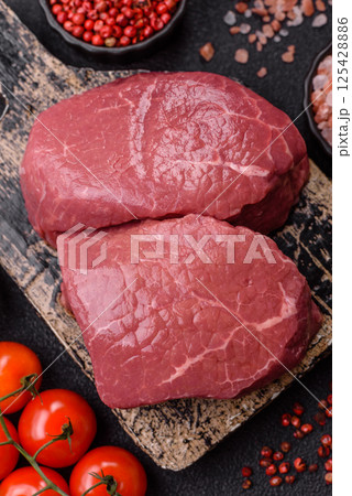 Raw beef tenderloin ribeye steak with salt and spices 125428886