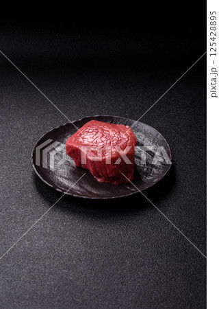 Raw beef tenderloin ribeye steak with salt and spices Raw beef tenderloin ribeye steak with salt and spices 125428895