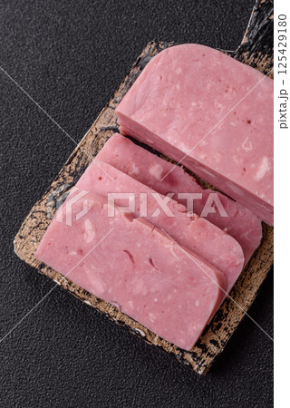 Delicious canned pink ham with salt, spices and herbs 125429180