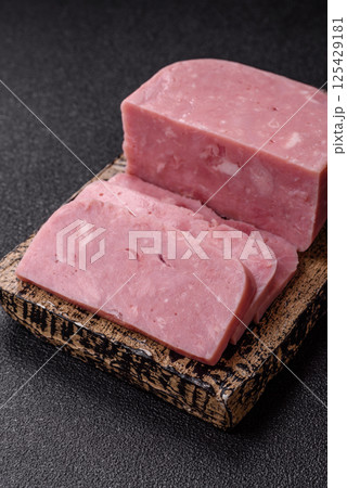 Delicious canned pink ham with salt, spices and herbs 125429181