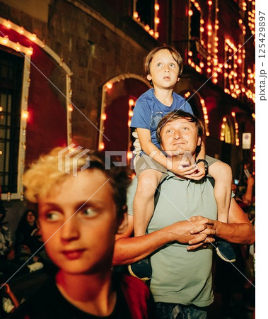 Father and Sons Watching Night Festival Celebrations 125429897