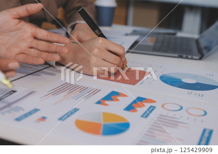 Accounting company provide finance and taxation planning for profitable cash flow, Auditor and accountant team working in office, analyze financial data and accounting record with calculator.Insight Accounting company provide finance and taxation planning for profitable cash flow, Auditor and accountant team working in office, analyze financial data and accounting record with calculator.Insight 125429909