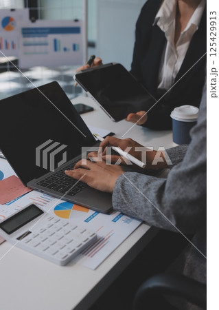 Accounting company provide finance and taxation planning for profitable cash flow, Auditor and accountant team working in office, analyze financial data and accounting record with calculator.Insight Accounting company provide finance and taxation planning for profitable cash flow, Auditor and accountant team working in office, analyze financial data and accounting record with calculator.Insight 125429913