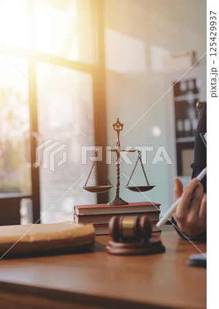 Judge gavel with Justice lawyers having team meeting at law firm background. Concepts of Law and Legal services. Judge gavel with Justice lawyers having team meeting at law firm background. Concepts of Law and Legal services. 125429937