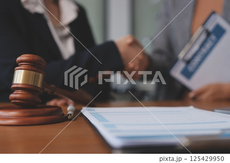 Judge gavel with Justice lawyers having team meeting at law firm background. Concepts of Law and Legal services. Judge gavel with Justice lawyers having team meeting at law firm background. Concepts of Law and Legal services. 125429950