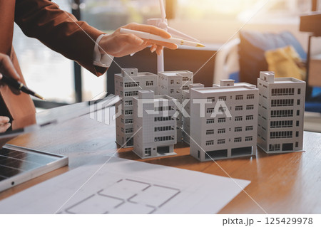 Discussion among businesspeople on the latest developments in solar cell panel technology and Solar Energy Environment city Concept. Discussion among businesspeople on the latest developments in solar cell panel technology and Solar Energy Environment city Concept. 125429978