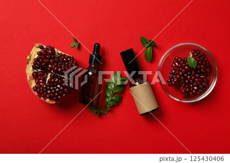 Self care and skincare products concept - pomegranate cosmetics Self care and skincare products concept - pomegranate cosmetics 125430406