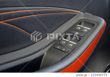 Close up view of black control panel on door of modern car. 125430775