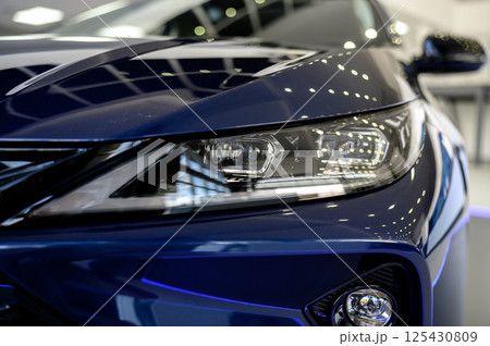Close up of the headlight of a new modern car Close up of the headlight of a new modern car 125430809