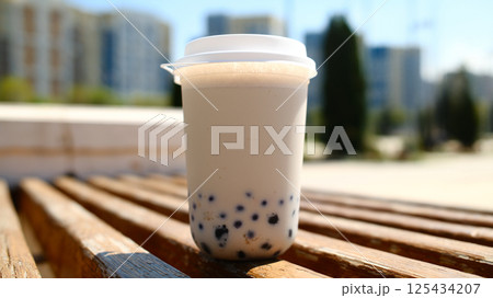 Milk bubble tea in plastic cup with blurred background 125434207