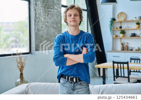 Portrait of confident handsome teenage boy with crossed arms 125434661
