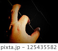 Hands holding a cage, a concept of being locked up and without freedom, a prisoner who is sentenced to prison. 125435582