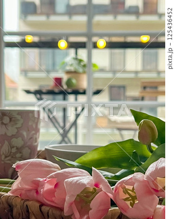 Decorative flowers in the living room in the style of boho or loft Decorative flowers in the living room in the style of boho or loft 125436452
