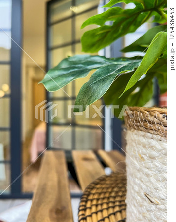 Balcony relax area with garden furniture, green flower, boho style Balcony relax area with garden furniture, green flower, boho style 125436453