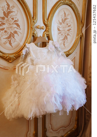 Cute dressy fluffy white dress for a girl. 125437682