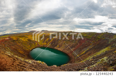 Volcanic crater Kerid with blue lake inside, at autumn day, Iceland Gold Circle tourist attraction. 125440243