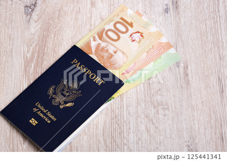 American passport with Canadian dollar 125441341
