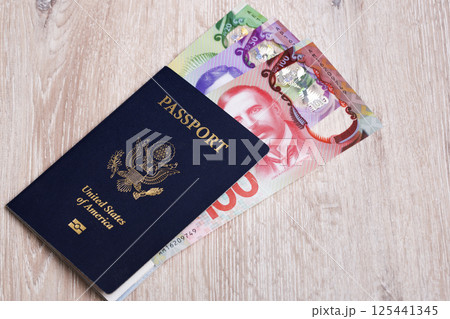 American passport with New Zealand dollar 125441345