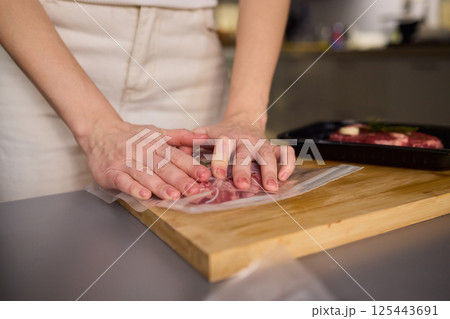 Sealing Fresh Meat for Preservation Using a Vacuum Sealer for Longer Lasting Freshness 125443691
