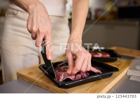 Mastering Skillful Meat Preparation Using a Very Sharp Knife for Culinary Excellence Mastering Skillful Meat Preparation Using a Very Sharp Knife for Culinary Excellence 125443703