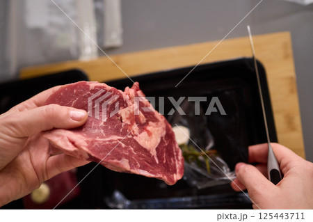 Mastering Skillful Meat Preparation Using a Very Sharp Knife for Culinary Excellence Mastering Skillful Meat Preparation Using a Very Sharp Knife for Culinary Excellence 125443711