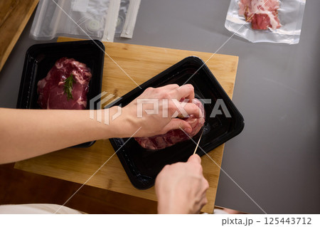 Mastering Skillful Meat Preparation Using a Very Sharp Knife for Culinary Excellence Mastering Skillful Meat Preparation Using a Very Sharp Knife for Culinary Excellence 125443712
