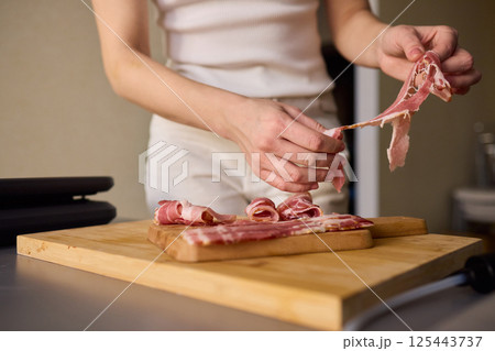 Artisan Style Meat Preparation on a Beautifully Crafted Wooden Board for Serving Artisan Style Meat Preparation on a Beautifully Crafted Wooden Board for Serving 125443737