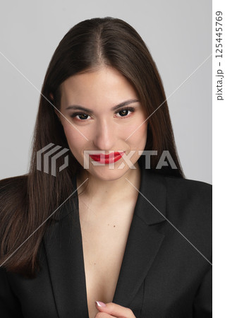 Beautiful woman with red lips and black hair portrait 125445769