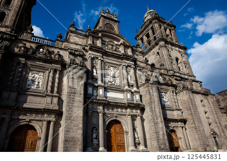 Facade of the historical Metropolitan Cathedral of Mexico City built between 1573 and 1813. Metropolitan Cathedral of the Assumption of the Most Blessed Virgin Mary into Heaven. 125445831