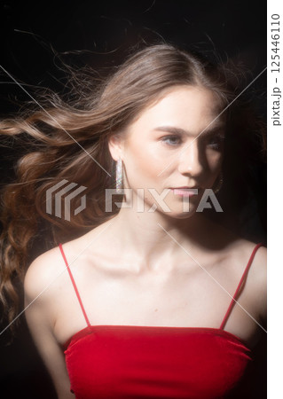 Beautiful brunette woman with long wavy hair studio portrait Beautiful brunette woman with long wavy hair studio portrait 125446110