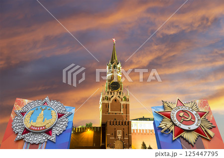 Moscow Kremlin (with orders of victory)--Victory Day celebration (WWII), Russia-- the most popular view. Against the sky with clouds. English translation from Russian: USSR, Victory, Patriotic war 125447795