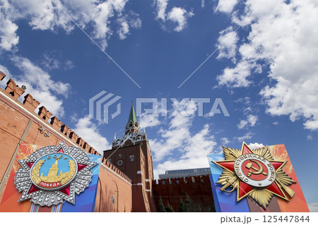 Moscow Kremlin (with orders of victory)--Victory Day celebration (WWII), Russia-- the most popular view. Against the sky with clouds. English translation from Russian: USSR, Victory, Patriotic war Moscow Kremlin (with orders of victory)--Victory Day celebration (WWII), Russia-- the most popular view. Against the sky with clouds. English translation from Russian: USSR, Victory, Patriotic war 125447844