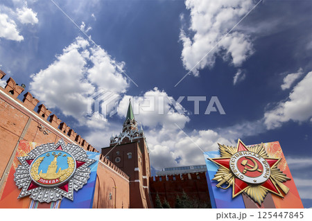 Moscow Kremlin (with orders of victory)--Victory Day celebration (WWII), Russia-- the most popular view. Against the sky with clouds. English translation from Russian: USSR, Victory, Patriotic war Moscow Kremlin (with orders of victory)--Victory Day celebration (WWII), Russia-- the most popular view. Against the sky with clouds. English translation from Russian: USSR, Victory, Patriotic war 125447845