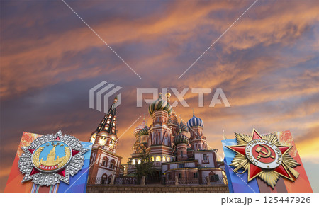 Temple of Basil the Blessed with orders of victory in honor of Victory Day celebration (WWII), Red Square, Moscow, Russia. Against the clouds 125447926