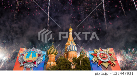 Cathedral of Intercession of Most Holy Theotokos on the Moat (Temple of Basil the Blessed) with orders of victory, and fireworks in honor of Victory Day celebration (WWII), Red Square, Moscow, Russia 125447931
