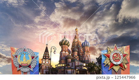 Temple of Basil the Blessed with orders of victory in honor of Victory Day celebration (WWII), Red Square, Moscow, Russia. Against the clouds Temple of Basil the Blessed with orders of victory in honor of Victory Day celebration (WWII), Red Square, Moscow, Russia. Against the clouds 125447966