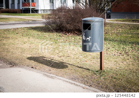 Outdoor Trash Bin for Pet Waste with Icon on Grass Outdoor Trash Bin for Pet Waste with Icon on Grass 125448142