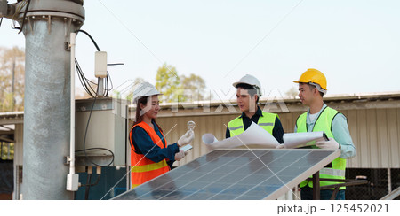 Sustainability and Energy Solutions. A professional team analyzing solar technology and its applications. Sustainability and Energy Solutions. A professional team analyzing solar technology and its applications. 125452021