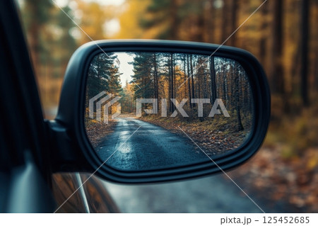Driving through autumn forests a scenic journey reflecting nature's beauty 125452685