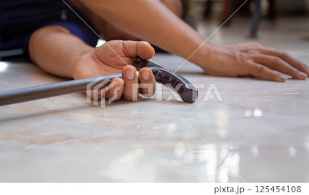 Senior man falling down at home because stumbled on a door kerb. Senior man falling down at home because stumbled on a door kerb. 125454108
