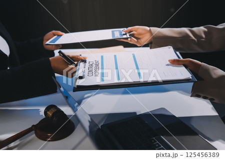 Concept of legal counseling. The lawyer or legal counsel is listening and providing advice to business people. Concept of legal counseling. The lawyer or legal counsel is listening and providing advice to business people. 125456389