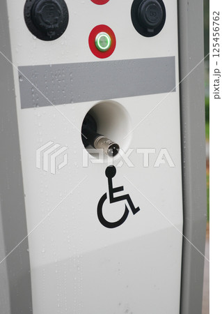Accessible charging station with disability symbol at public location 125456762