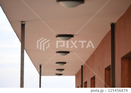 Unique lighting fixtures on a modern building's ceiling 125456874