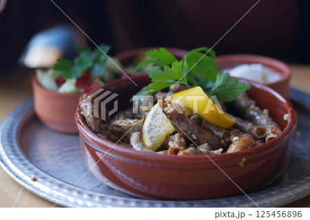 Traditional dolma grape leaves on a plate 125456896