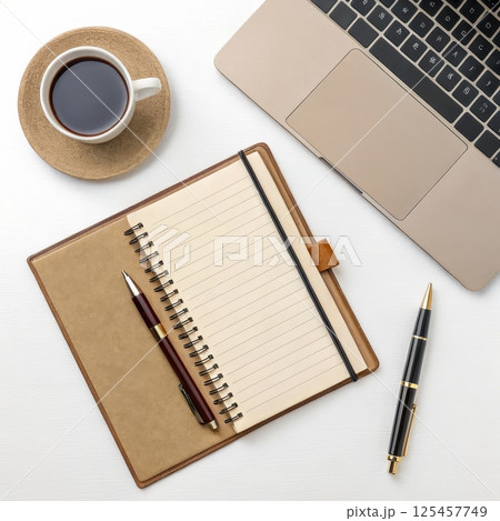 A workspace with a laptop notebook and coffee mug long title A well organized and minimalist 125457749