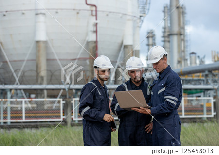 Team professional worker power plant factory construction power plant. Engineer wearing safety uniform helmet at energy petrochemical industry. Industrial site energy power. 125458013